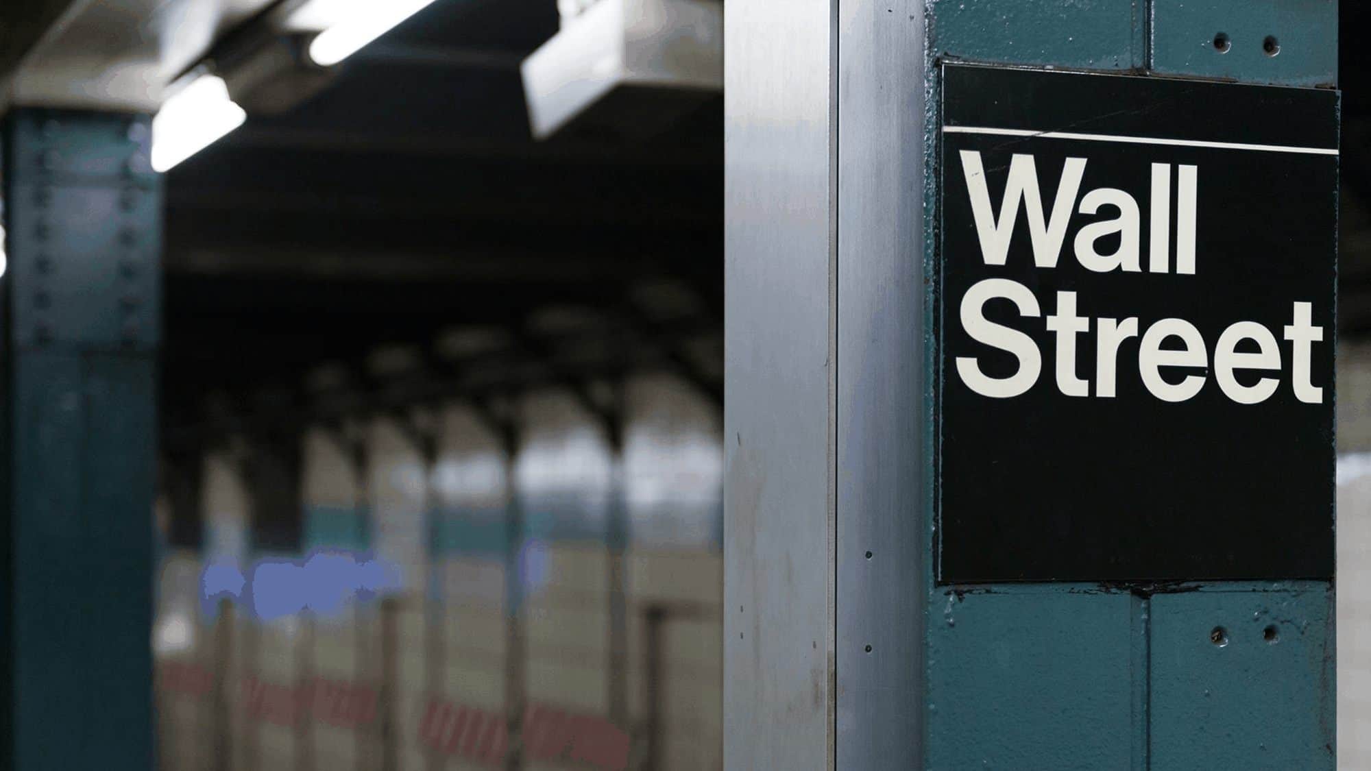 Subway sign reads "Wall Street".